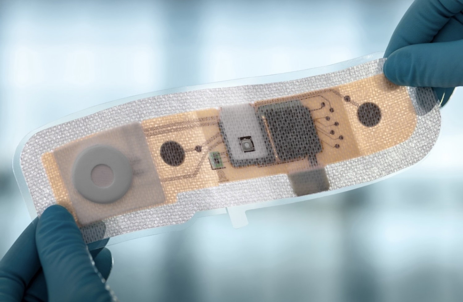 Fraunhofer IZM with project partners showcasing a stretchable wireless patch with electronics integrated into a textile substrate for medical monitoring of cardiac patients so that vital data such as oxygen saturation in the blood, chest movement and bio-impedance can be measured and transmitted directly to an app for monitoring by clinicians. © Fraunhofer IZM | Volker Mai