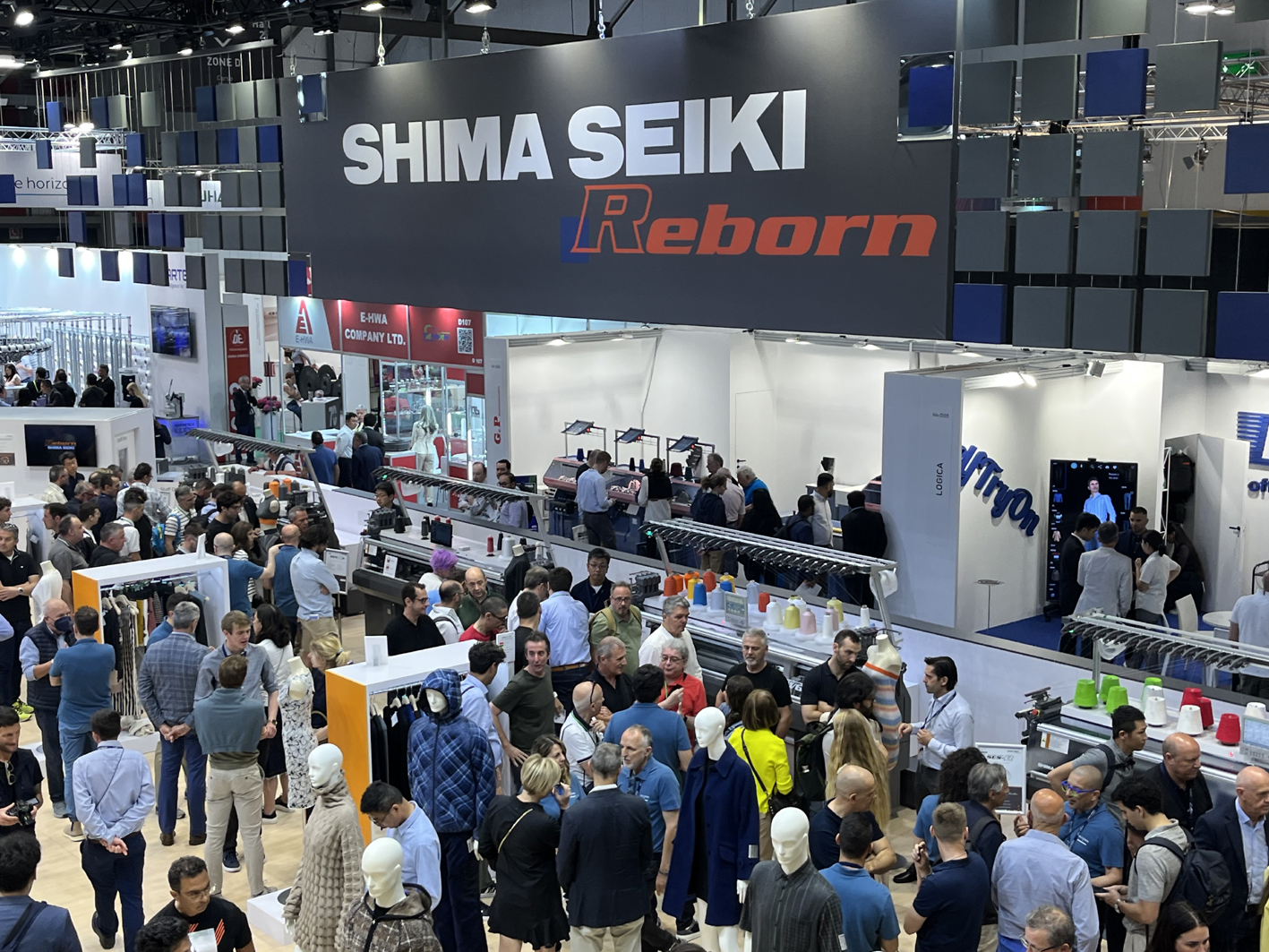 Shima Seiki’s always busy stand at ITMA 2023. Flat knitting machinery sales increased by 61% last year. © A.Wilson